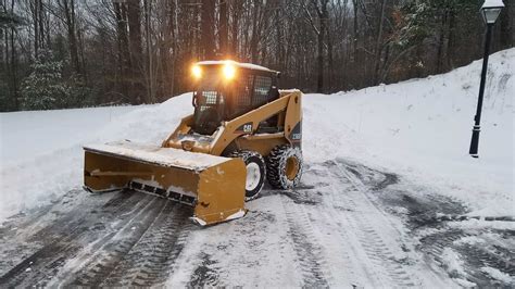 cat skid steer plowing snow|snow plow for cats.